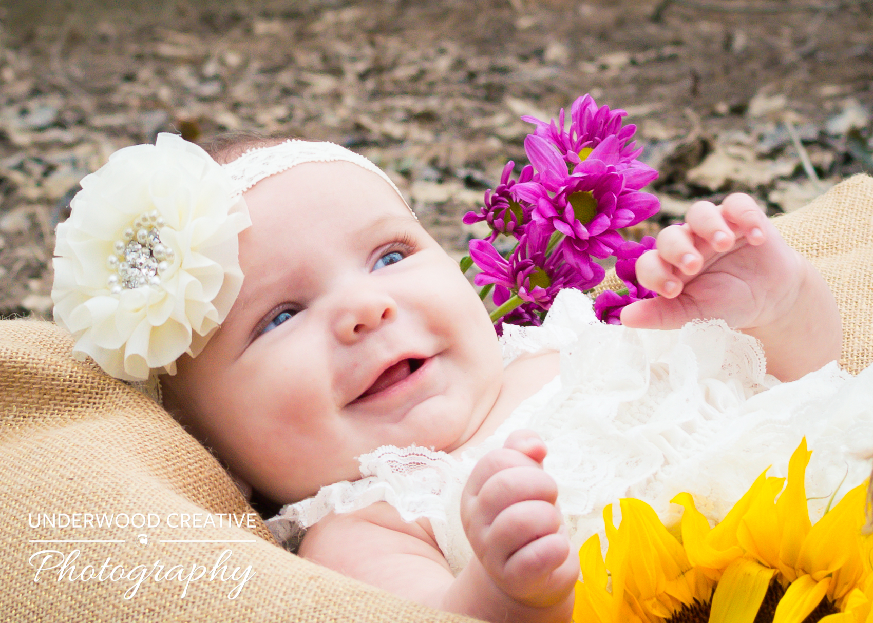 Baby with flowers portrait